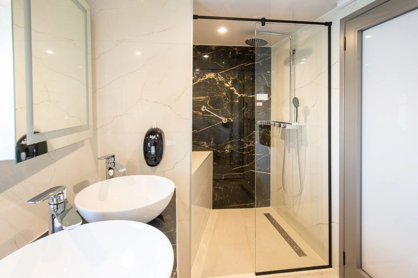 Modern private bathroom with walk-in rain shower