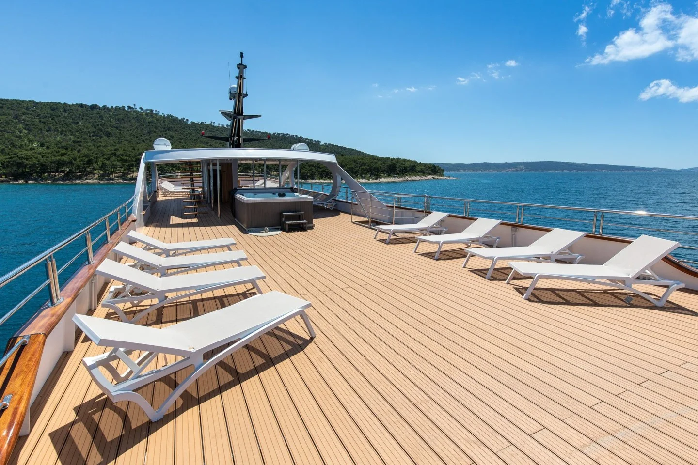 Spacious sun deck with loungers and Adriatic views